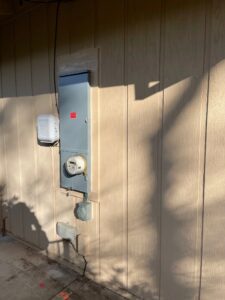 A power box on the side of a building.